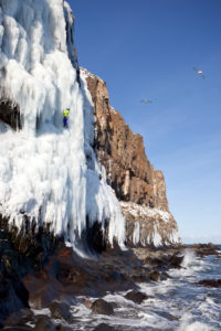 Ice climbing in Akureyri, Fjord Eyjafjördur, Nordland, Iceland Ice climbing in Akureyri, Fjord Eyjafjördur, Nordland, Iceland